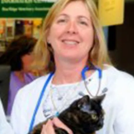 Dr. Nancy Hall holding a black cat